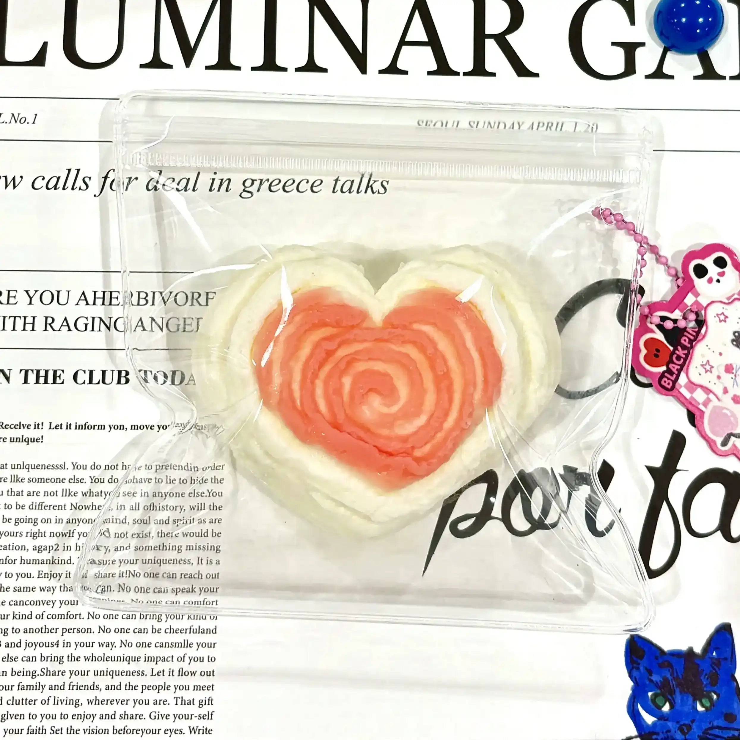 Cute pink roll squishy with heart pattern – soft and squeezable
